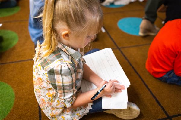 Students inside their classrooms learning. 